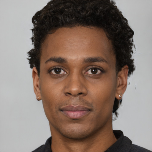 Neutral black young-adult male with short  black hair and brown eyes