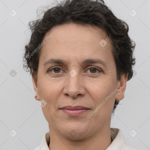 Joyful white adult female with short  brown hair and brown eyes