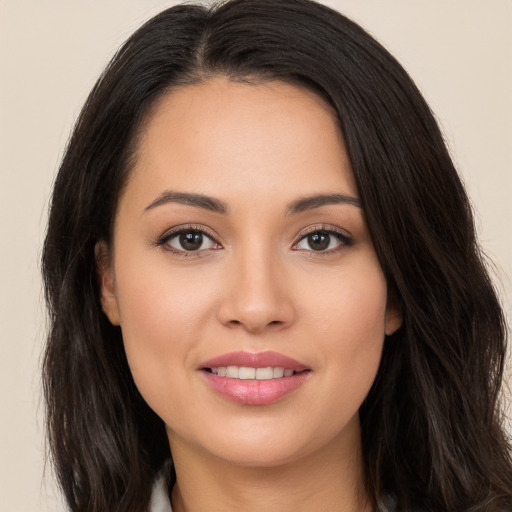 Joyful white young-adult female with long  black hair and brown eyes