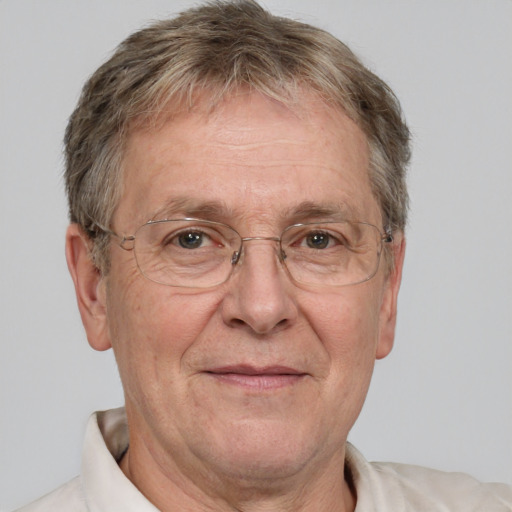 Joyful white middle-aged male with short  gray hair and brown eyes