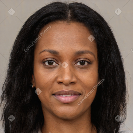 Joyful black young-adult female with long  brown hair and brown eyes