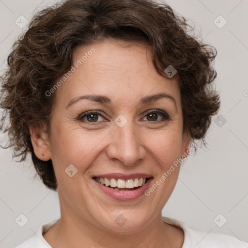 Joyful white adult female with short  brown hair and brown eyes