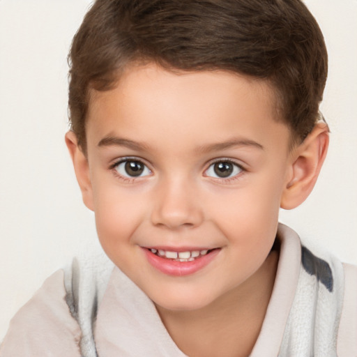 Joyful white child male with short  brown hair and brown eyes