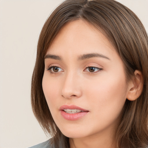 Neutral white young-adult female with long  brown hair and brown eyes