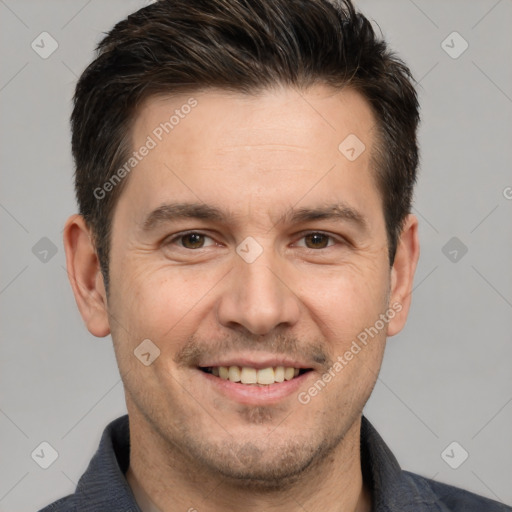 Joyful white adult male with short  brown hair and brown eyes