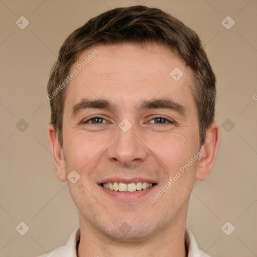 Joyful white young-adult male with short  brown hair and brown eyes