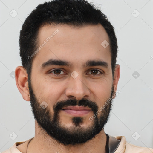 Joyful latino young-adult male with short  black hair and brown eyes