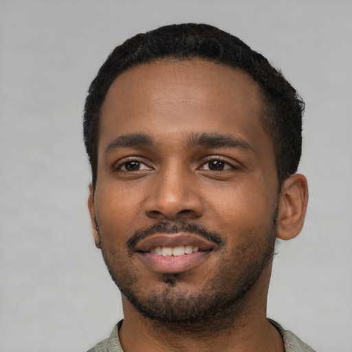 Neutral black young-adult male with short  black hair and brown eyes
