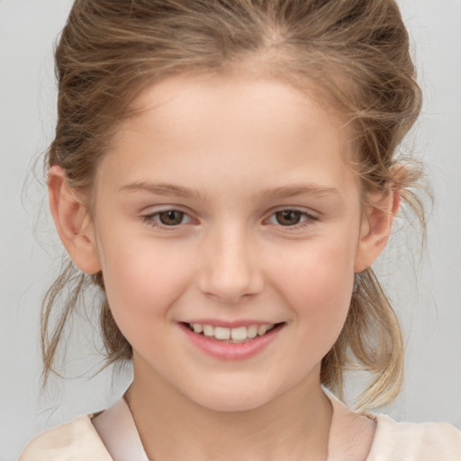 Joyful white child female with medium  brown hair and brown eyes