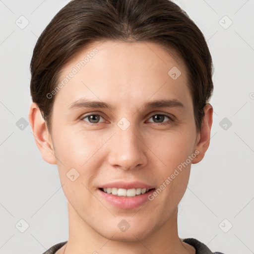 Joyful white young-adult female with short  brown hair and grey eyes