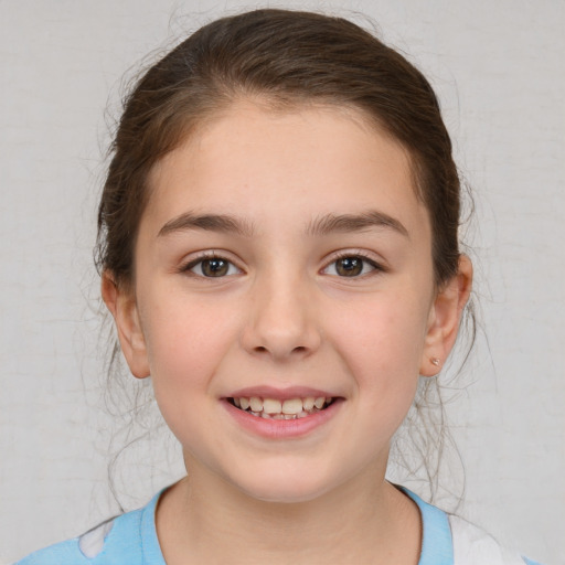 Joyful white child female with medium  brown hair and brown eyes