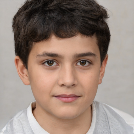 Joyful white child male with short  brown hair and brown eyes