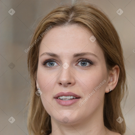 Joyful white young-adult female with medium  brown hair and blue eyes