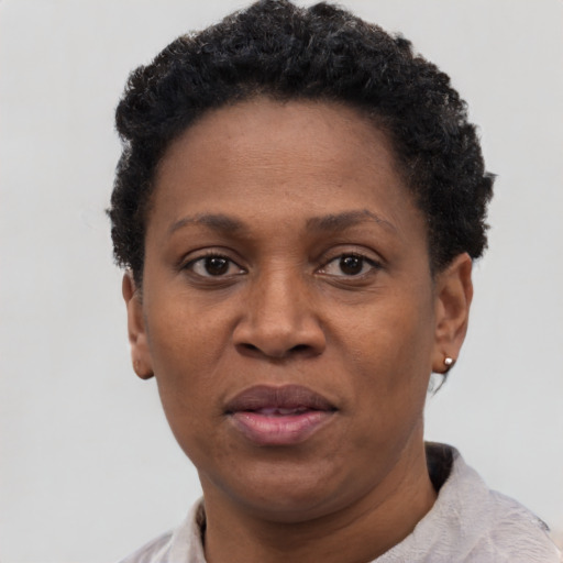 Neutral black adult female with short  black hair and brown eyes