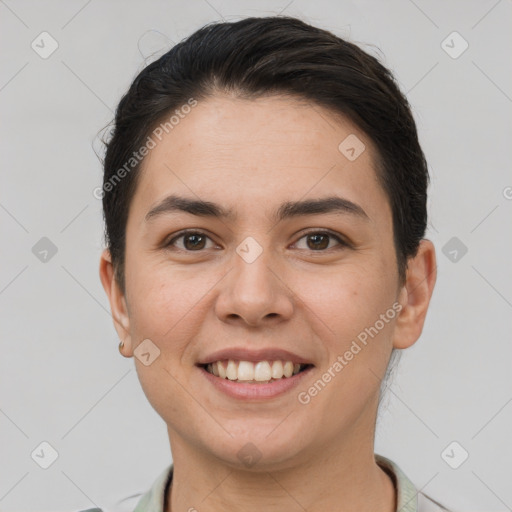 Joyful white young-adult female with short  brown hair and brown eyes