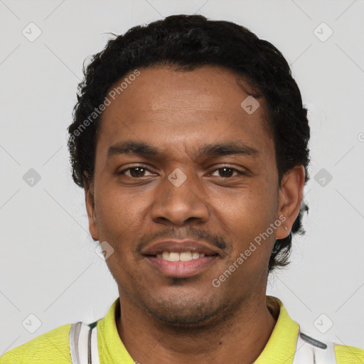 Joyful black young-adult male with short  black hair and brown eyes