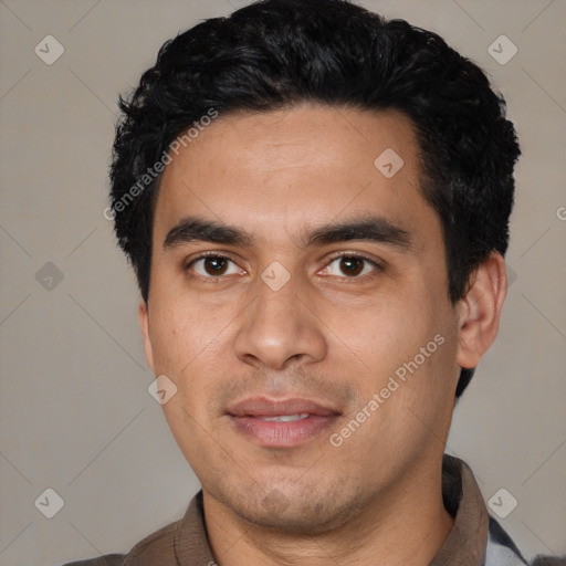 Joyful latino young-adult male with short  black hair and brown eyes