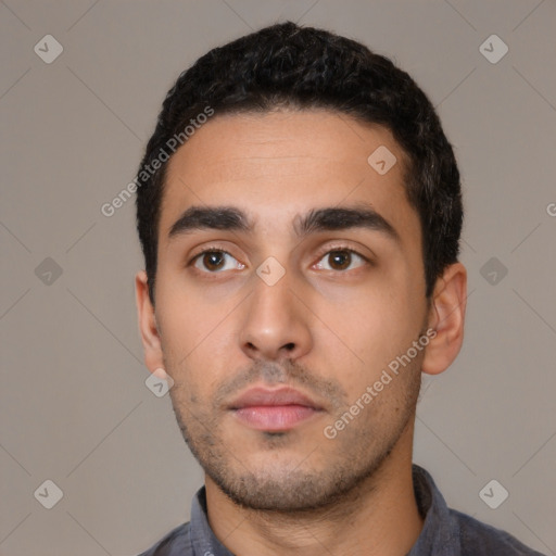 Neutral latino young-adult male with short  black hair and brown eyes