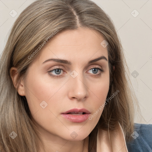 Neutral white young-adult female with long  brown hair and brown eyes