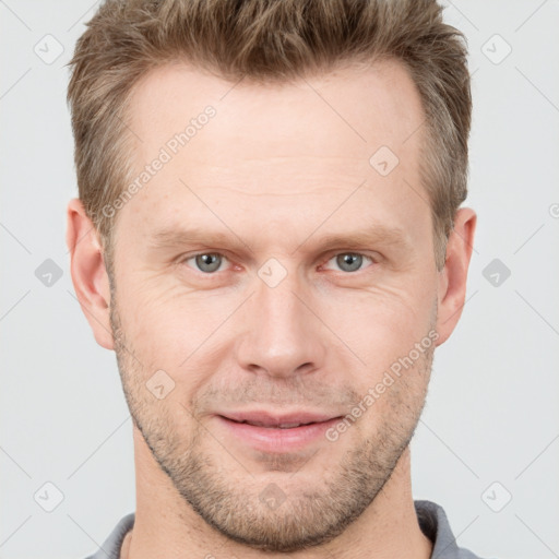 Joyful white adult male with short  brown hair and grey eyes