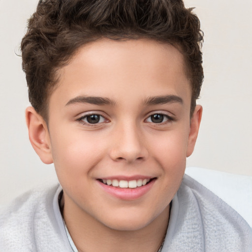 Joyful white child male with short  brown hair and brown eyes