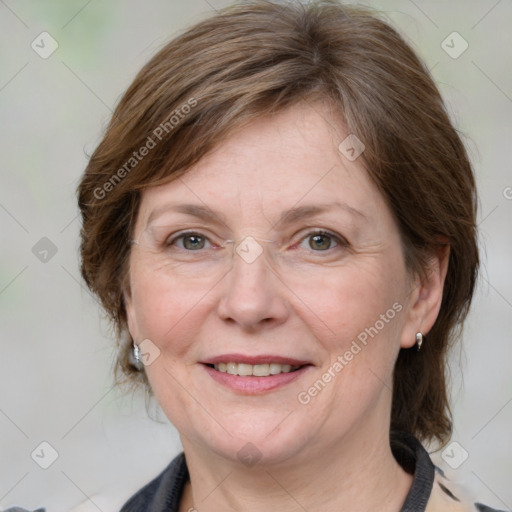 Joyful white adult female with medium  brown hair and grey eyes