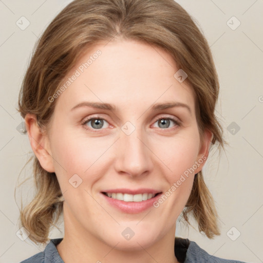 Joyful white young-adult female with medium  brown hair and blue eyes