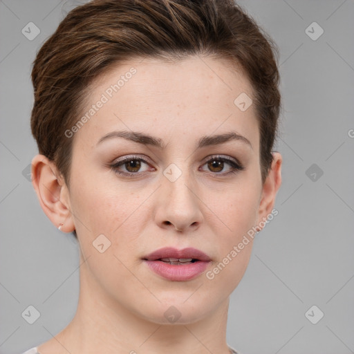 Joyful white young-adult female with short  brown hair and grey eyes