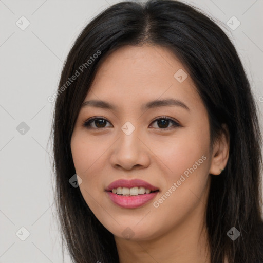 Joyful asian young-adult female with long  brown hair and brown eyes