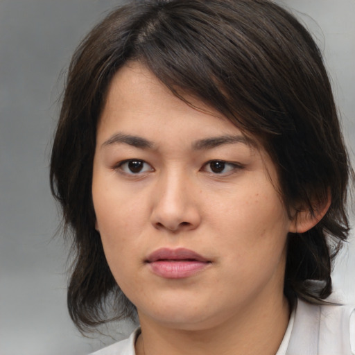 Neutral asian young-adult female with medium  brown hair and brown eyes