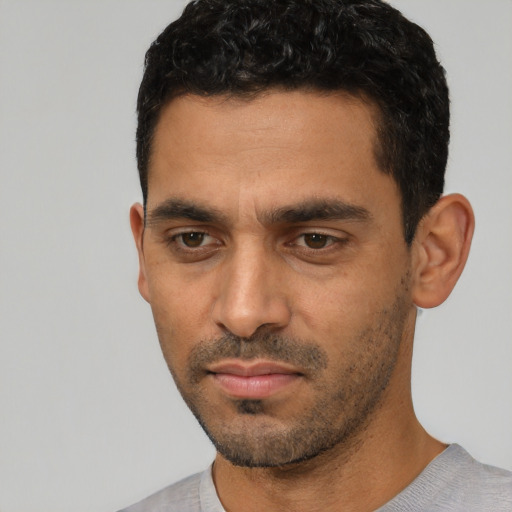 Neutral white young-adult male with short  black hair and brown eyes