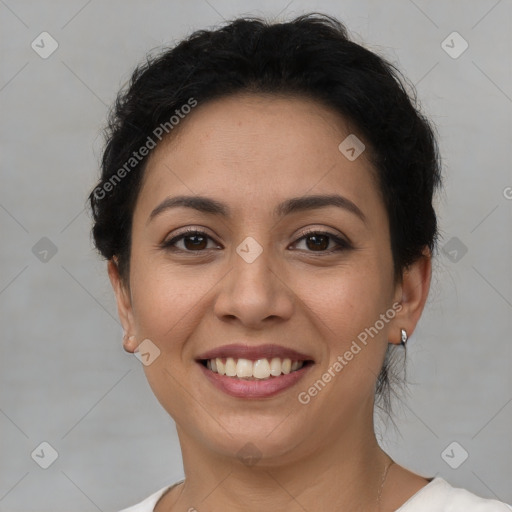 Joyful latino young-adult female with short  brown hair and brown eyes