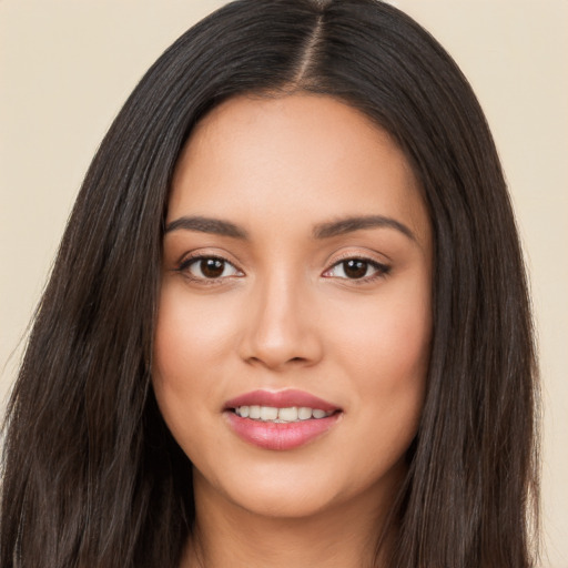 Joyful white young-adult female with long  black hair and brown eyes