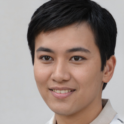 Joyful asian young-adult male with short  black hair and brown eyes