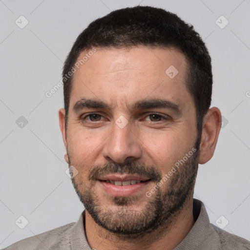 Joyful white young-adult male with short  black hair and brown eyes