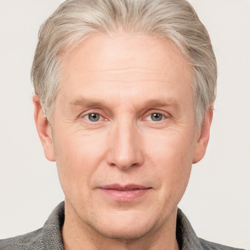 Neutral white adult male with short  blond hair and grey eyes