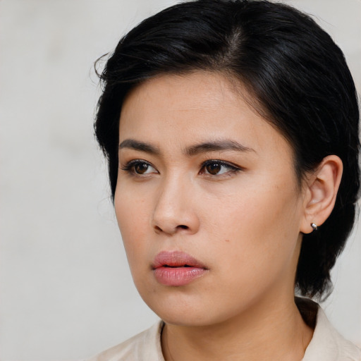 Neutral latino young-adult female with medium  black hair and brown eyes