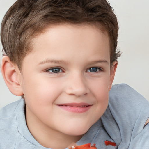 Joyful white child male with short  brown hair and brown eyes