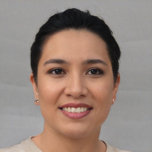 Joyful asian young-adult female with short  black hair and brown eyes