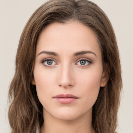 Neutral white young-adult female with long  brown hair and green eyes