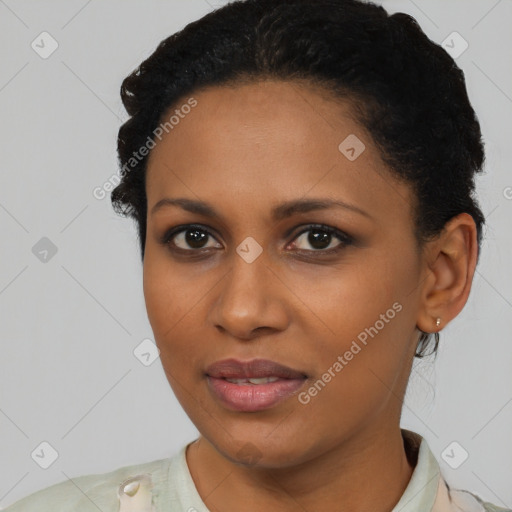 Joyful black young-adult female with short  black hair and brown eyes