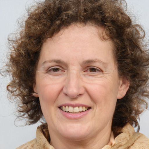 Joyful white middle-aged female with medium  brown hair and brown eyes