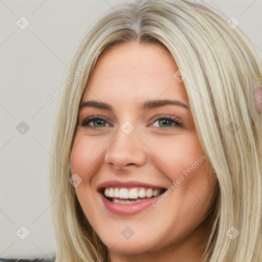 Joyful white young-adult female with long  brown hair and blue eyes