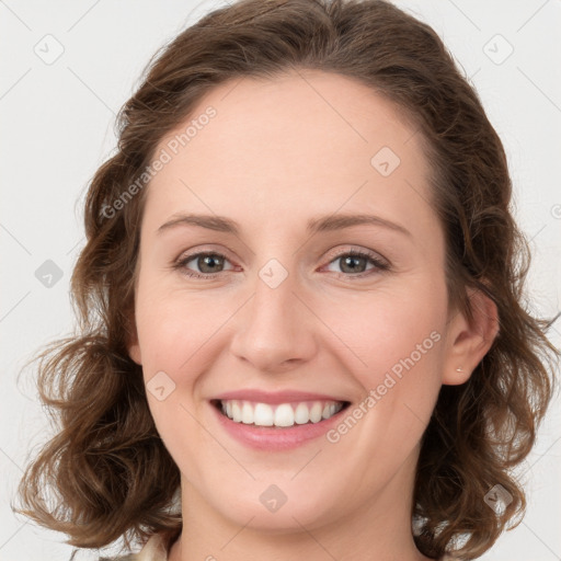 Joyful white young-adult female with medium  brown hair and green eyes