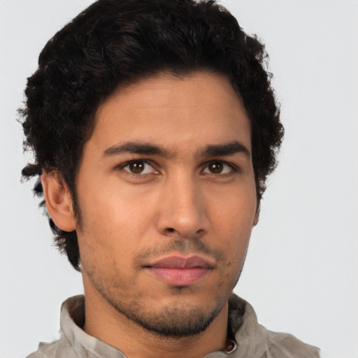 Neutral latino young-adult male with short  brown hair and brown eyes