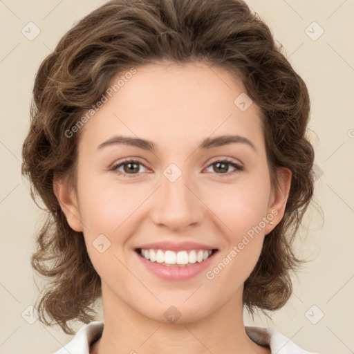 Joyful white young-adult female with medium  brown hair and green eyes