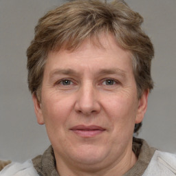 Joyful white adult male with short  brown hair and grey eyes