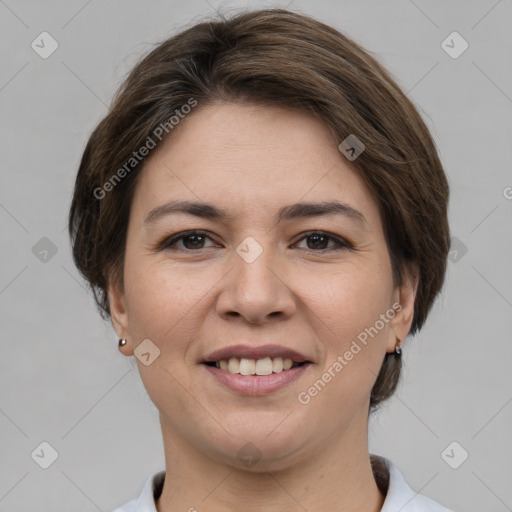 Joyful white young-adult female with medium  brown hair and grey eyes