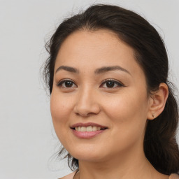 Joyful white young-adult female with medium  brown hair and brown eyes