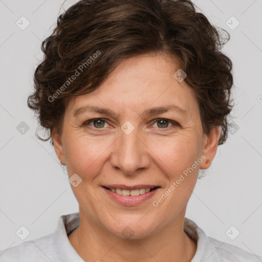 Joyful white adult female with short  brown hair and brown eyes